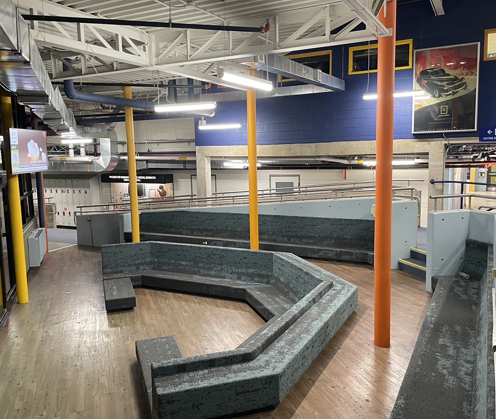 <ul> 
            <b>Seating Area</b><br>
            This space is a seating area next to the staircase at Sheridan College, located in S wing. It’s an indoor, permanent spot with unique bench-style seating arranged in a cozy, social layout. Students often use this space to relax, wait between classes, or have informal discussions. The open design and bright colors make it a welcoming area for short breaks.
          </ul>